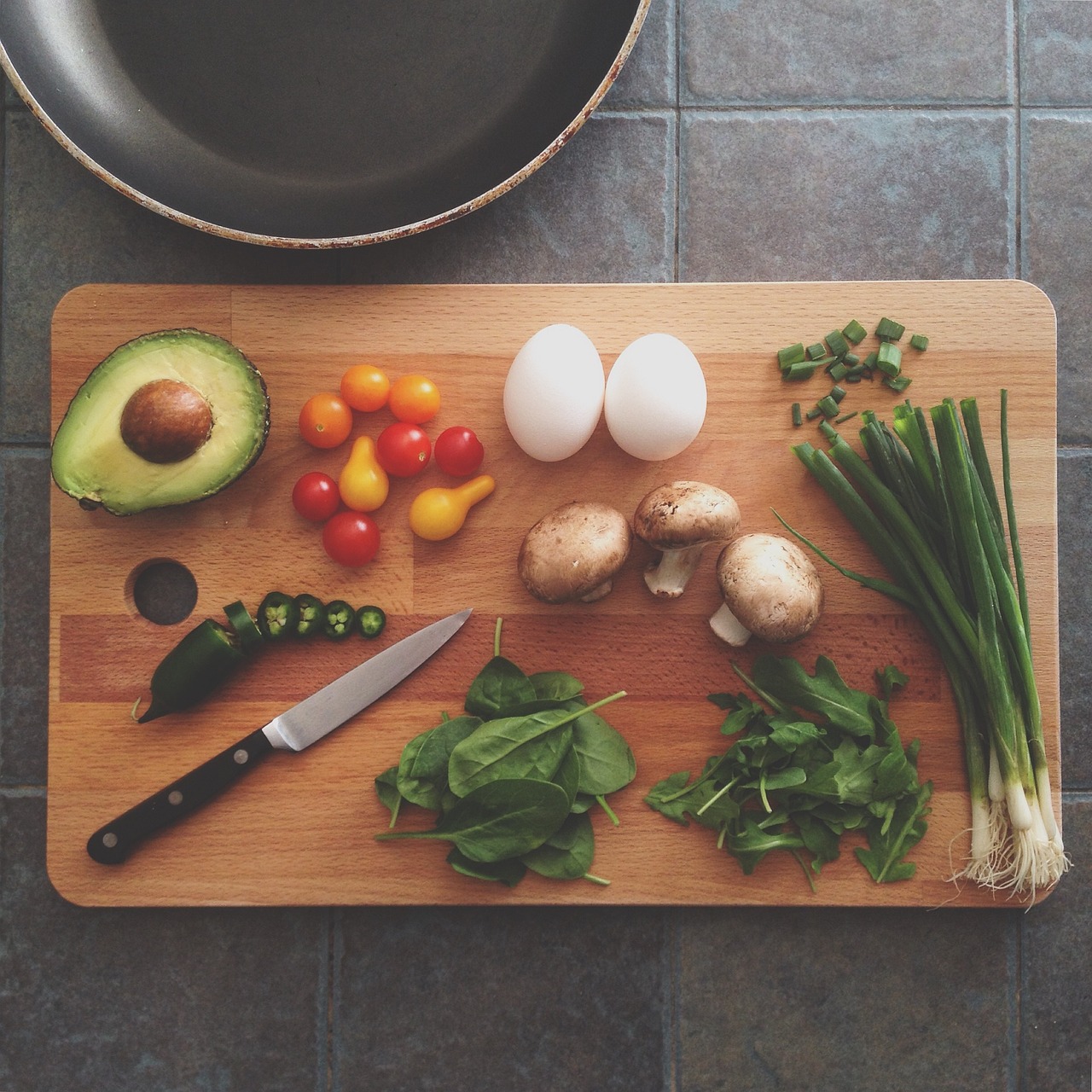 ingredients and kinfe on a cutting board 